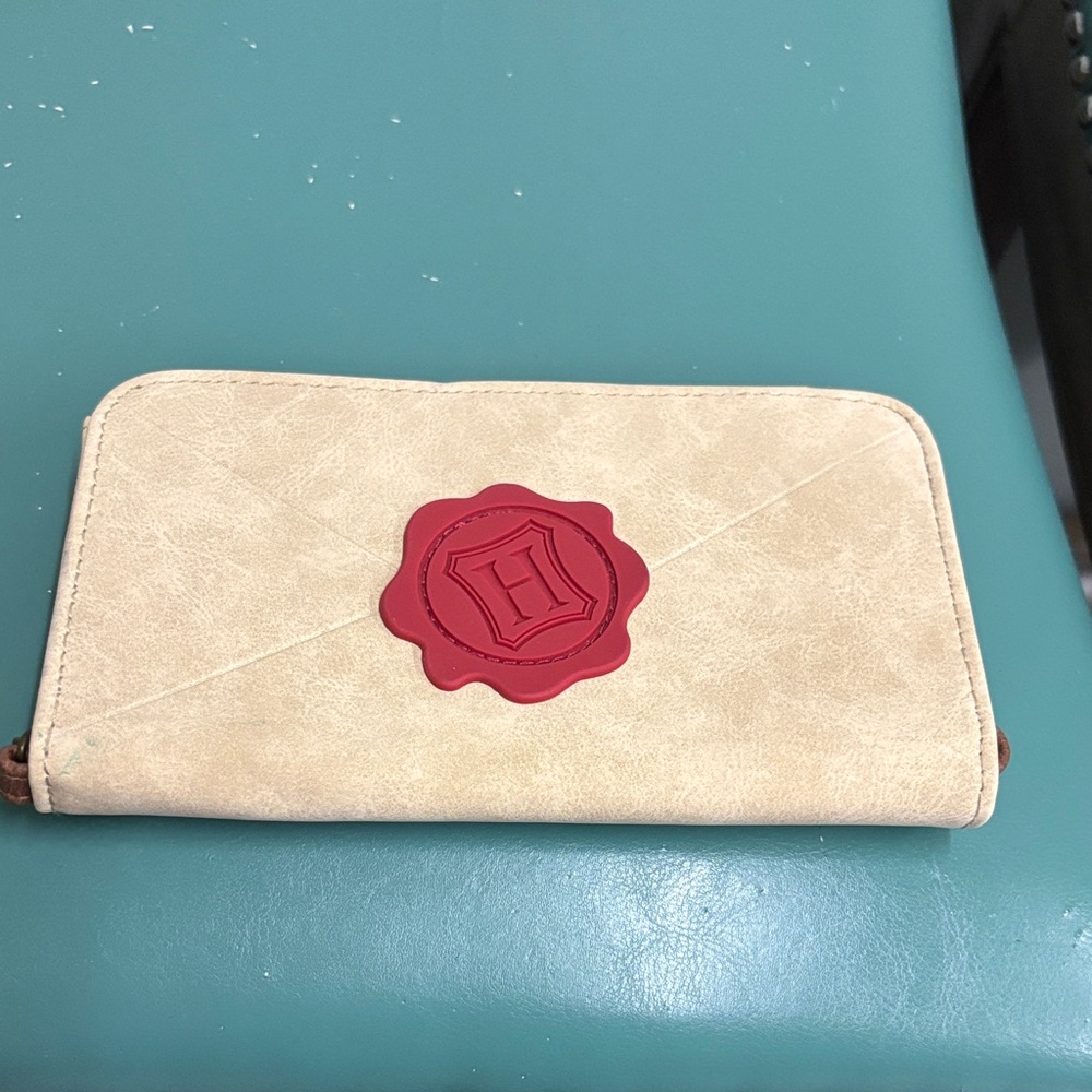 Stylish Cream Wallet with Red Emblem